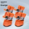 Orange soft fleece-lined dog boots showing warm interior 11