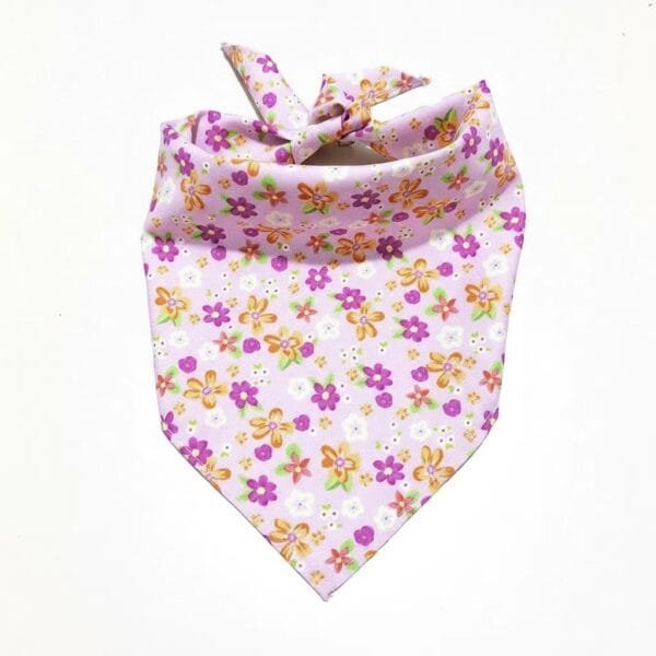 golden retriever wearing dog bandanas pink floral triangle bandana outdoors